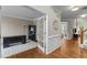 Home office with hardwood floors and glass paned doors at 712 Brittley Way, Apex, NC 27502