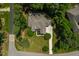 Aerial view showcases a home with a well-manicured lawn and an inviting backyard with a patio at 7552 Hasentree Club Dr, Wake Forest, NC 27587