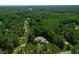 Aerial view of a beautiful neighborhood showcasing the house surrounded by lush green trees and well-maintained streets at 7552 Hasentree Club Dr, Wake Forest, NC 27587