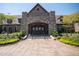 Beautiful stone clubhouse with covered entrance and manicured landscaping at 7552 Hasentree Club Dr, Wake Forest, NC 27587