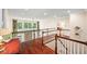 Bright foyer featuring hardwood floors, natural light from the windows, and open view of the lower level at 7552 Hasentree Club Dr, Wake Forest, NC 27587