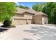 Spacious four-car garage with a large concrete driveway and attractive curb appeal at 7552 Hasentree Club Dr, Wake Forest, NC 27587