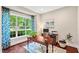 Inviting home office with a large window, hardwood floors, and a stylish desk at 7552 Hasentree Club Dr, Wake Forest, NC 27587
