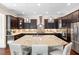 Modern kitchen with stainless steel appliances, granite counters, and center island at 7552 Hasentree Club Dr, Wake Forest, NC 27587