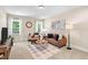 Cozy living room with neutral walls, recessed lighting, and comfortable seating furniture in a bright, inviting space at 7552 Hasentree Club Dr, Wake Forest, NC 27587