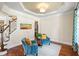 Cozy sitting room with decorative ceilings, accent chairs, and hardwood floors at 7552 Hasentree Club Dr, Wake Forest, NC 27587