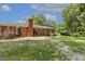 Nice backyard with full brick home, gravel patio for entertaining, and lush green space for activities at 780 Leslie Campbell Ave, Lillington, NC 27546