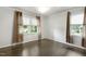 Bright bedroom with hardwood floors and large windows, offering a comfortable and inviting space at 780 Leslie Campbell Ave, Lillington, NC 27546