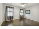 Bright bedroom with hardwood floors, large windows, and neutral walls, offering a peaceful retreat at 780 Leslie Campbell Ave, Lillington, NC 27546