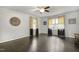Bedroom featuring hardwood floors, natural light, and a ceiling fan, offering comfort and style at 780 Leslie Campbell Ave, Lillington, NC 27546