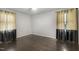 Spacious bedroom with hardwood flooring, large windows, and neutral paint, creating a serene atmosphere at 780 Leslie Campbell Ave, Lillington, NC 27546