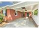 Covered carport featuring a brick wall, concrete floor and access to the home's entrance at 780 Leslie Campbell Ave, Lillington, NC 27546