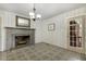 Dining area features a fireplace, gray floors with a door to the outside at 780 Leslie Campbell Ave, Lillington, NC 27546