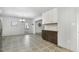 Dining room flows into kitchen, featuring a neutral palette and updated flooring at 780 Leslie Campbell Ave, Lillington, NC 27546