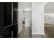 Inviting foyer with hardwood floors, closet space, and a view into the home's living areas at 780 Leslie Campbell Ave, Lillington, NC 27546