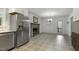 Modern kitchen and dining room showcase updated stainless steel appliances and a fireplace at 780 Leslie Campbell Ave, Lillington, NC 27546