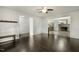 Open concept living room with hardwood floors, offering seamless access to other areas of the home at 780 Leslie Campbell Ave, Lillington, NC 27546