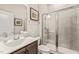 Modern bathroom featuring a glass-enclosed shower, stylish vanity, and contemporary fixtures at 797 S Wilma St, Angier, NC 27501