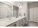 Bathroom featuring double sink vanity with shaker cabinets, and a glass enclosed shower at 797 S Wilma St, Angier, NC 27501