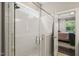 Bathroom with subway tiled shower and glass door at 797 S Wilma St, Angier, NC 27501
