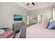 Bedroom features a tray ceiling, dresser with a television, and neutral furnishings at 797 S Wilma St, Angier, NC 27501