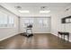 A spacious fitness room features hardwood floors, natural light, and modern treadmill equipment at 797 S Wilma St, Angier, NC 27501