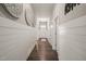 Inviting hallway featuring decorative wall art and wood-look flooring at 797 S Wilma St, Angier, NC 27501