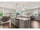 Stylish kitchen with island seating open to the dining and living area at 797 S Wilma St, Angier, NC 27501