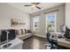 Bright office space with wood floors, a comfortable seating area, and a modern desk setup at 797 S Wilma St, Angier, NC 27501