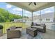 Inviting screened porch with comfortable seating, perfect for enjoying the outdoors at 797 S Wilma St, Angier, NC 27501