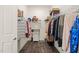 Walk-in closet with wood floor and built-in wire shelving at 797 S Wilma St, Angier, NC 27501