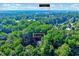 An aerial view of 838 Joyner Ct. surrounded by mature trees and near Heritage Golf Course at 838 Joyner Ct, Wake Forest, NC 27587