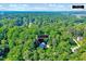 An aerial view of 838 Joyner Ct. showing mature trees, neighborhood, and close proximity to Wegmans at 838 Joyner Ct, Wake Forest, NC 27587