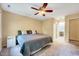 Bedroom with a ceiling fan, a comfortable bed, and an ensuite bathroom at 838 Joyner Ct, Wake Forest, NC 27587