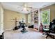 Bedroom featuring a ceiling fan, built-in shelving, and workout equipment at 838 Joyner Ct, Wake Forest, NC 27587