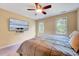 Bedroom with a ceiling fan, large TV, and comfortable bed at 838 Joyner Ct, Wake Forest, NC 27587