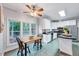 Bright kitchen with stainless steel appliances, island, and a cozy breakfast nook at 838 Joyner Ct, Wake Forest, NC 27587