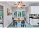 Bright kitchen with stainless steel appliances, island, and a cozy breakfast nook at 838 Joyner Ct, Wake Forest, NC 27587