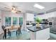 Bright kitchen with stainless steel appliances, island, and a cozy breakfast nook at 838 Joyner Ct, Wake Forest, NC 27587