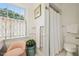 Well-lit bathroom with a walk-in shower, vintage fixtures, and classic charm at 1004 E Willowbrook Dr, Burlington, NC 27215