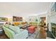 Bright living room showcasing stylish furniture, hardwood floors, and detailed fireplace at 1004 E Willowbrook Dr, Burlington, NC 27215