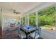 Beautiful sunroom with a game table and views of the landscaped gardens at 1004 E Willowbrook Dr, Burlington, NC 27215
