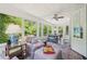 Bright and airy sunroom with floor-to-ceiling windows offering serene backyard views at 1004 E Willowbrook Dr, Burlington, NC 27215
