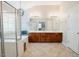 Spacious bathroom featuring a double vanity, glass shower, bathtub, and tile floors at 1005 Hidden River Ct, Raleigh, NC 27614