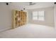 Bonus room with shelving, neutral paint and carpet at 1005 Hidden River Ct, Raleigh, NC 27614