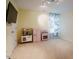 Bonus room with a wall-mounted television, colorful curtain, and play kitchen at 1005 Hidden River Ct, Raleigh, NC 27614