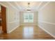 Spacious dining room featuring hardwood floors, elegant lighting, and decorative wall accents at 1005 Hidden River Ct, Raleigh, NC 27614