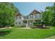 Charming two-story home featuring lush green landscaping and traditional architectural design in a desirable neighborhood at 1005 Hidden River Ct, Raleigh, NC 27614