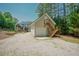 Image displays a two-car garage with a staircase leading up to a door at 1005 Hidden River Ct, Raleigh, NC 27614
