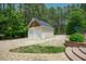 View of the garage with two bays and a large driveway at 1005 Hidden River Ct, Raleigh, NC 27614